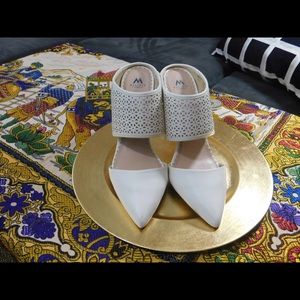 Pointy toe mule with laser cutout design